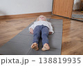 Little girl practicing yoga, lying in Savasana Corpse Pose on a mat. 138819935