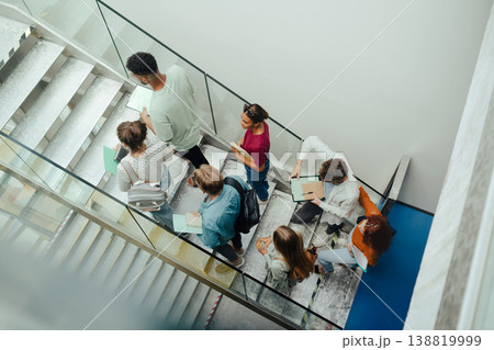 Group of university students walking up stairs, back to school concept. Group of university students walking up stairs, back to school concept. 138819999