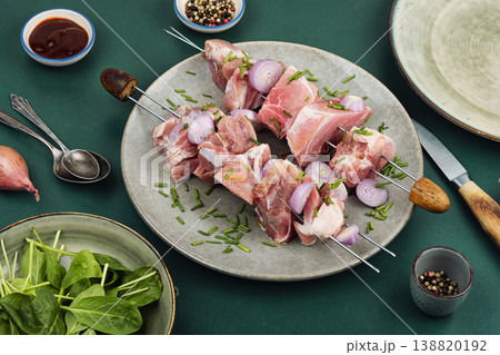 Raw Pork and Onion Skewers for Grilling on Plate 138820192