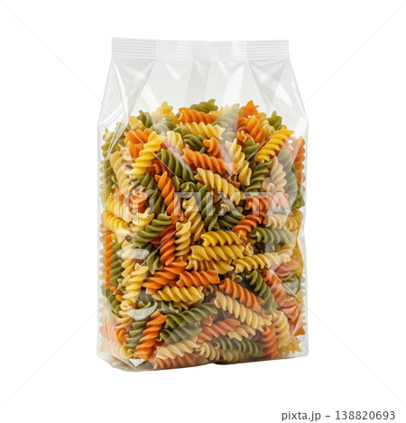 Uncooked tricolor spiral pasta in transparent packaging, isolated studio shot. Healthy Italian food. 138820693