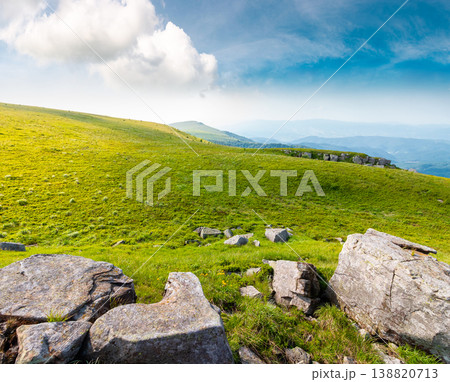 mountain summer landscape. meadow with giant stones among the grass on the hillside. awe view near the peak of mountain smooth in morning dappled light. great outdoors of ukraine mountain summer landscape. meadow with giant stones among the grass on the hillside. awe view near the peak of mountain smooth in morning dappled light. great outdoors of ukraine 138820713