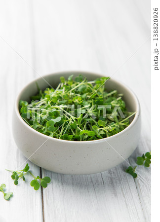 Fresh microgreens in bowl on white wooden table Fresh microgreens in bowl on white wooden table 138820926
