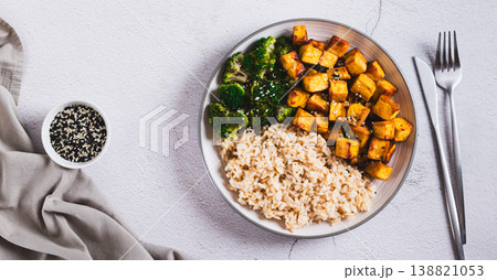 A plate of rice, fried tofu and broccoli on the table top view web banner A plate of rice, fried tofu and broccoli on the table top view web banner 138821053