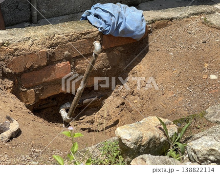 Underground Metal Pipe Installation In Excavated Ground Hole Underground Metal Pipe Installation In Excavated Ground Hole 138822114