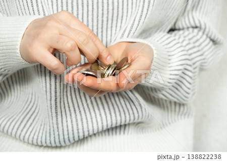 Hands count change. The concept of money and saving Hands count change. The concept of money and saving 138822238