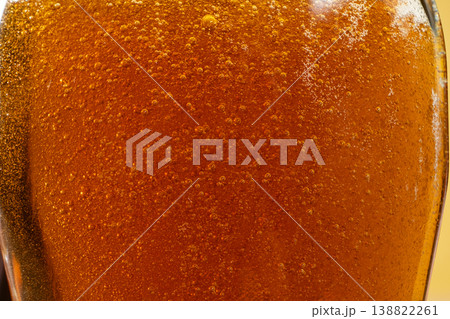 Abstract background of golden maple syrup texture 138822261