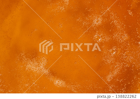 Macro texture of organic maple syrup with tiny air bubbles 138822262