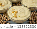 Vegan appetizer hummus garnished with boiled chickpeas. 138822330