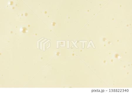 Smooth condensed milk texture with tiny bubbles macro. 138822340