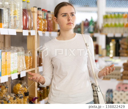 Young woman buyer forgot what she wanted to buy Young woman buyer forgot what she wanted to buy 138822429