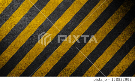A high-contrast background featuring diagonal yellow and black safety stripes with a grainy asphalt texture, symbolizing caution, danger, and industrial work zones A high-contrast background featuring diagonal yellow and black safety stripes with a grainy asphalt texture, symbolizing caution, danger, and industrial work zones 138822998