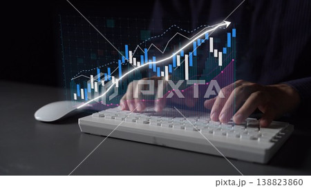 Hands Typing on Computer Keyboard with Stock Market Graph and Data Visualization Representing Financial Growth and Economic Trends Copula 138823860