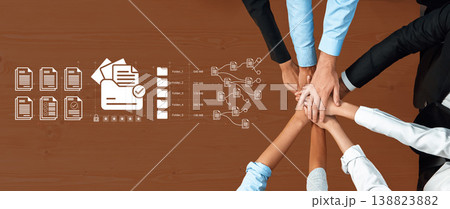 Team Collaboration Concept with Hands Together on Office Desk with Document Icons and Data Flow Representation in Business Environment Ledger Team Collaboration Concept with Hands Together on Office Desk with Document Icons and Data Flow Representation in Business Environment Ledger 138823882