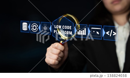 Business Professional Holding Magnifying Glass Over Low Code Platform Icons and Data Analytics Concept in Dark Background Quark Business Professional Holding Magnifying Glass Over Low Code Platform Icons and Data Analytics Concept in Dark Background Quark 138824038