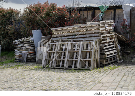 Wooden broken pallets in warm cloudy day Wooden broken pallets in warm cloudy day 138824179