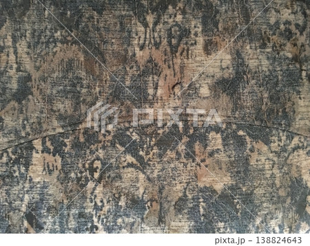Wood surface with worn patterns and engravings from past use in a workshop or home setting during the day Wood surface with worn patterns and engravings from past use in a workshop or home setting during the day 138824643