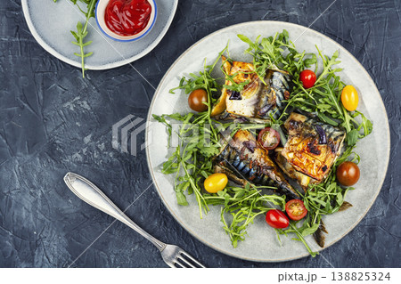 Baked mackerel fillets paired with fresh greens 138825324