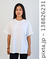 Ecommerce promotional image showcasing confident woman wearing white tshirt in studio setting 138826231
