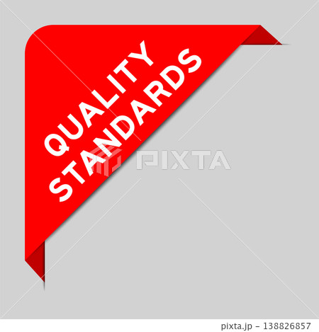 Red color of corner label banner with word quality standards on gray background 138826857