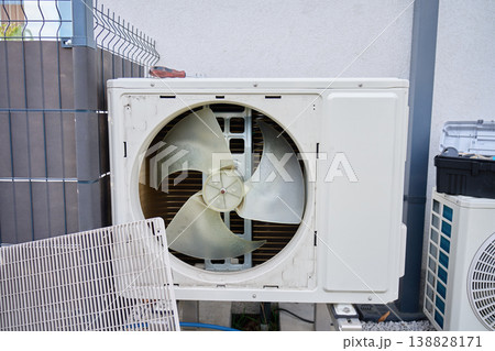 Open outdoor heat pump unit during maintenance service 138828171