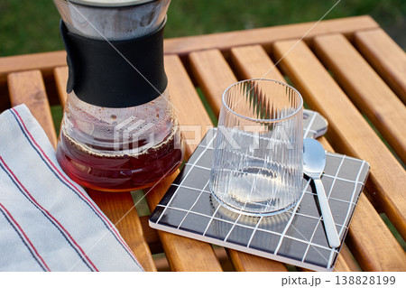 Specialty pour over coffee dripper setup with carafe outdoors 138828199