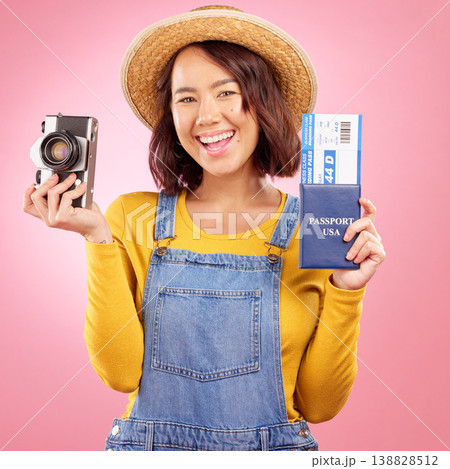 Tourist woman, camera and passport in studio portrait for travel, photography or excited by pink background. Gen z student girl, airplane ticket or identity documents for compliance with vintage tech 138828512