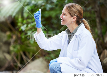 Forest, sample and woman scientist test water for research or inspection of the ecosystem and environment study. Science, sustainable and professional environmentalist doing carbon footprint exam 138828712