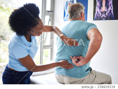Physiotherapy, chiropractor and senior man with back pain or physiotherapist consulting a patient for muscle injury. Arthritis, physical and medical professional help elderly person with massage 138829119