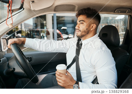 Business man, coffee cup and driving car for morning commute, transportation and waiting in traffic. Corporate indian male employee, travel and driver at steering wheel for journey on road with drink Business man, coffee cup and driving car for morning commute, transportation and waiting in traffic. Corporate indian male employee, travel and driver at steering wheel for journey on road with drink 138829168