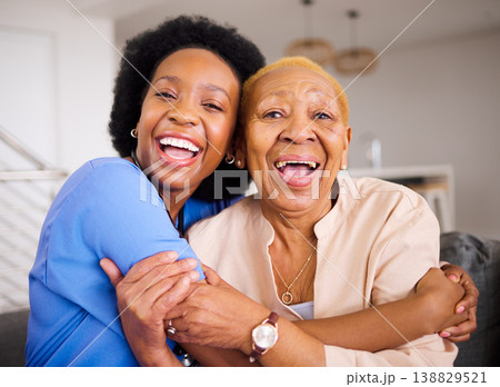 Black people, nurse and patient hug in elderly care for love, support and trust together on sofa at home. Portrait of happy African medical caregiver enjoying time with senior female person in house Black people, nurse and patient hug in elderly care for love, support and trust together on sofa at home. Portrait of happy African medical caregiver enjoying time with senior female person in house 138829521