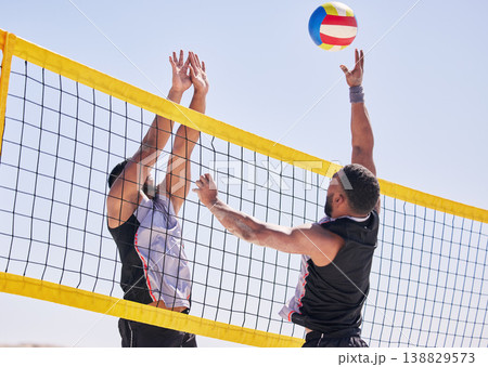Beach, volleyball and team with competition at ocean and sea with exercise, sport and fitness. Summer, outdoor and training people playing for health, action games and workout with ball in nature 138829573