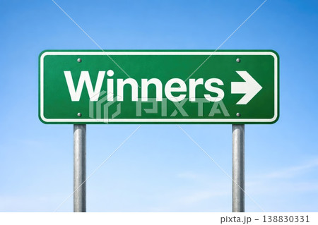 Green winners direction sign with arrow pointing right on clear sky background 138830331