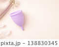 Purple menstrual cup on soft pastel background feminine hygiene concept 138830345
