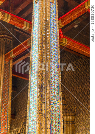 Tiny mirror pieces and gold surfaces show careful exterior work from the Rattanakosin era. The close framing reveals patient traditional craft. Tiny mirror pieces and gold surfaces show careful exterior work from the Rattanakosin era. The close framing reveals patient traditional craft. 138830736
