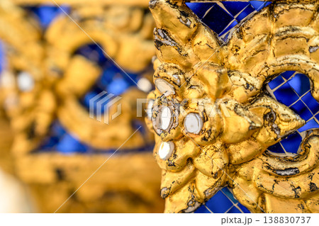 Tiny mirror pieces and gold surfaces show careful exterior work from the Rattanakosin era. The close framing reveals patient traditional craft. Tiny mirror pieces and gold surfaces show careful exterior work from the Rattanakosin era. The close framing reveals patient traditional craft. 138830737