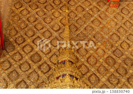 Tiny mirror pieces and gold surfaces show careful exterior work from the Rattanakosin era. The close framing reveals patient traditional craft. Tiny mirror pieces and gold surfaces show careful exterior work from the Rattanakosin era. The close framing reveals patient traditional craft. 138830740