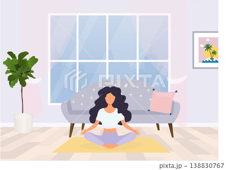 Young woman sitting in yoga posture and meditating. Meditation, relaxation at home. 138830767