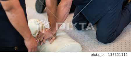 CPR training using and an AED and bag mask valve on an adult training manikin.  138831113