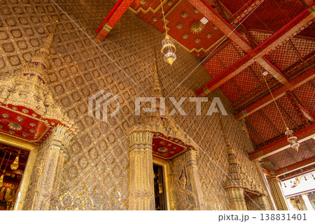 Patterned walls, frames, and roof edges create a rich study of Thai temple design. Repeated motifs and colors fill each close architectural view. 138831401