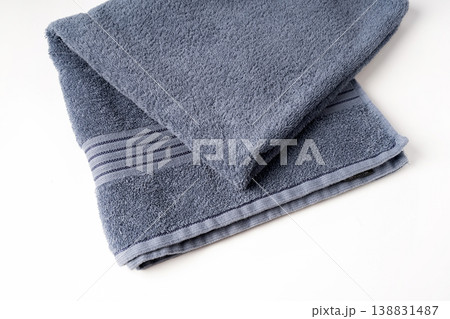 Folded bath towel isolated on white background Folded bath towel isolated on white background 138831487