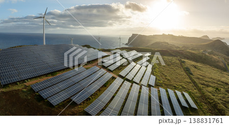 Solar energy panels photovoltaic cell and wind power plants on the seashore landscape for production of renewable green energy Solar energy panels photovoltaic cell and wind power plants on the seashore landscape for production of renewable green energy 138831761