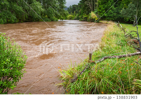 Swollen muddy river after heavy rain 138831903