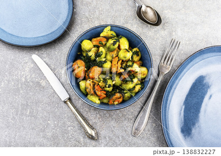 Brussels sprouts with mussels on a plate 138832227