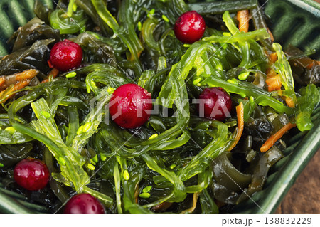 Fresh seaweed salad with cranberries, clean eating concept. Fresh seaweed salad with cranberries, clean eating concept. 138832229