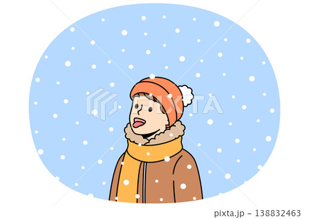 Litle boy opens mouth and eating snow, enjoying winter weather and new year mood Litle boy opens mouth and eating snow, enjoying winter weather and new year mood 138832463