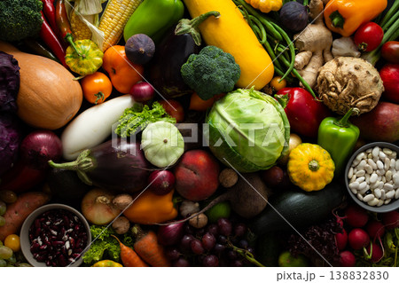 Fresh vegetables and fruits fill a surface after being gathered from the garden, showcasing a variety of colors and shapes during the harvest time in autumn Fresh vegetables and fruits fill a surface after being gathered from the garden, showcasing a variety of colors and shapes during the harvest time in autumn 138832830