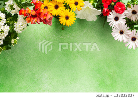 A beautiful array of spring flowers in various colors adorns a balcony, bringing life and brightness to the outdoor area. The flowers add joy and warmth to the setting 138832837