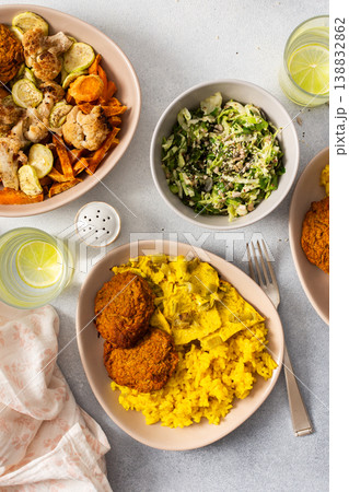 A colorful spread featuring rice with rhubarb fried eggs, baked sweet potato, and sauteed cauliflower and zucchini A colorful spread featuring rice with rhubarb fried eggs, baked sweet potato, and sauteed cauliflower and zucchini 138832862