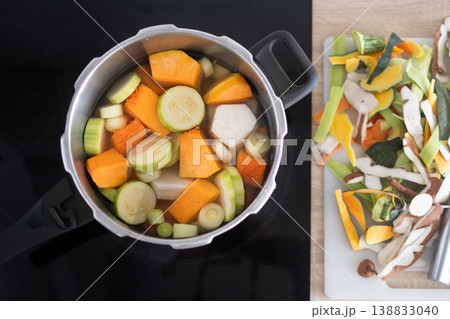 Healthy homemade vegetable soup preparation with lentils and fresh ingredients in pot Healthy homemade vegetable soup preparation with lentils and fresh ingredients in pot 138833040