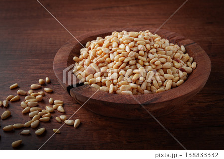 peeled pine nuts, in a wooden bowl, on a wooden table, close-up, no people, peeled pine nuts, in a wooden bowl, on a wooden table, close-up, no people, 138833332